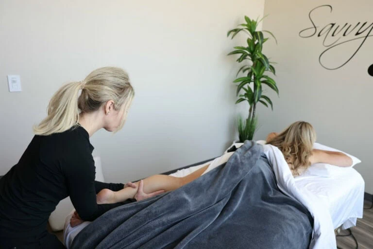 Woman getting a massage at Savvy Wellness