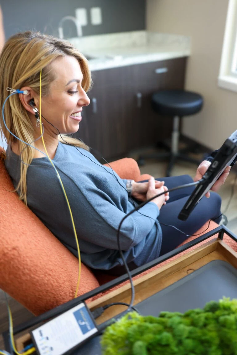 Woman using a neurofeedback machine