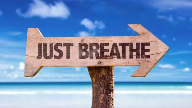 Sign that says "Just Breathe"