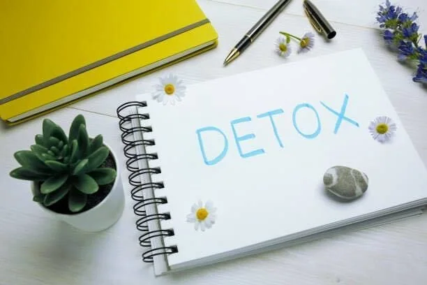Detox written on piece of paper
