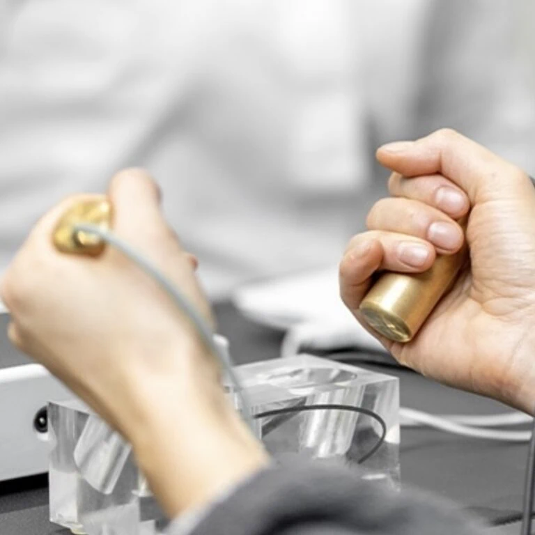 hands holding BioEnergetic Scan Equipment