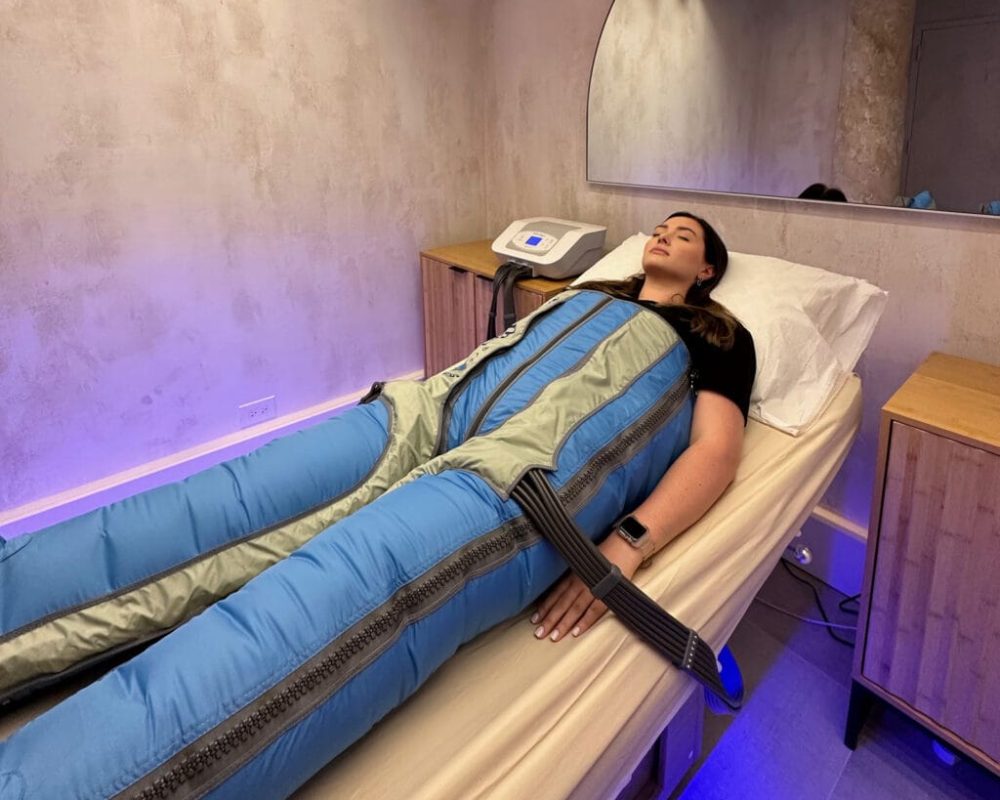 woman laying in compression bed
