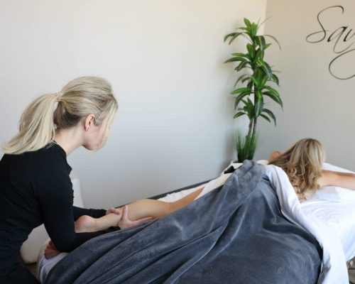 Woman getting a massage at Savvy Wellness