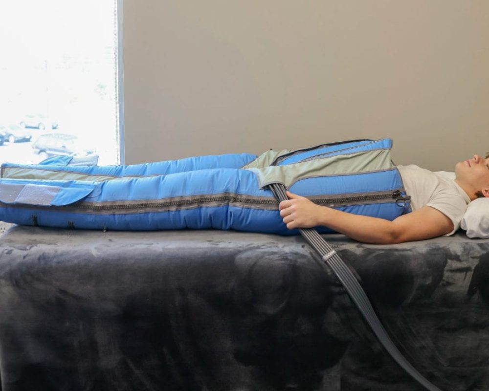 Man laying in compression bed