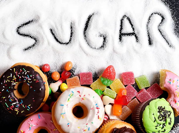mix of sweet cakes, donuts and candy with sugar spread
